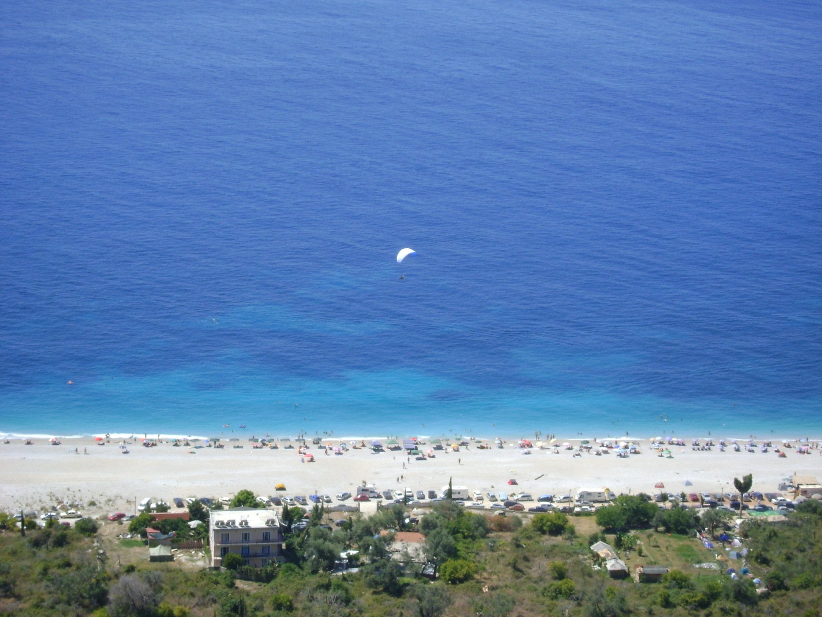 Panoramic view of Dhërmi beach and turquoise water on the Albanian Riviera